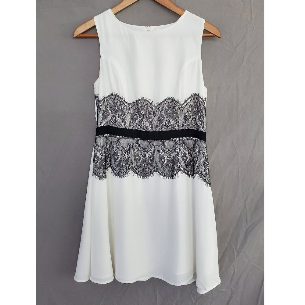 Sleeveless White Dress with Black Lace Details